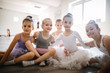 © NDABCREATIVITY - Group of fit happy children exercising ballet in studio together