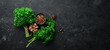 © Yaruniv-Studio - Parsley, spices and herbs. On a black stone background. Top view. Free space for your text.