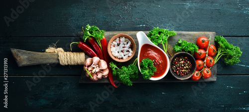 Fotomural Set of red sauces on a wooden background