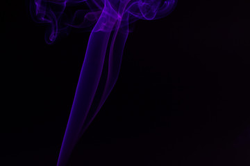 Colorful smoke close-up on a black background