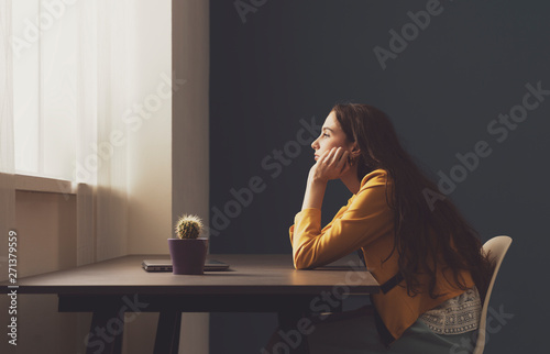 Fotografía Sad lonely young woman sitting at home
