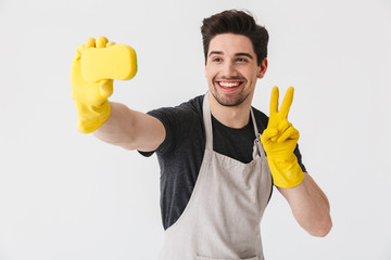 Wall Mural - Handsome brunette houseman wearing apron