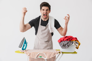 Wall Mural - Handsome brunette houseman wearing apron