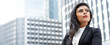 © Atstock Productions - Powerful Latin businesswoman in city office building banner background
