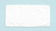 White cotton towel mock up template fabric wiper isolated on blue background with clipping path, flat lay top view