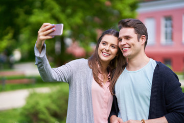 Wall Mural - Couple of tourists taking pictures