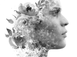 Wall Mural - Paintography. Double exposure. Close up profile of man with strong features and flawless skin dissolving behind hand painted floral watercolor and ink painting, black and white