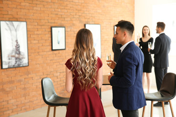 Wall Mural - Couple at exhibition in modern art gallery