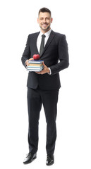 Handsome male teacher with books on white background