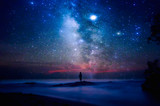 Fototapeta Fototapety kosmos - Starry night sky over sea and beach with man silhouette. man standing on sea beach under starry sky.