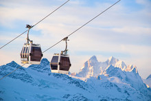 Ski-lift And Ski Slope In Snowy Mountains At Sunny Winter Day