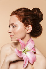 Wall Mural - beauty portrait of an attractive young topless redhead woman