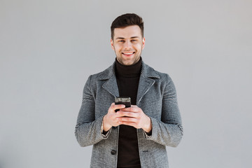 Sticker - Attractive man wearing coat standing