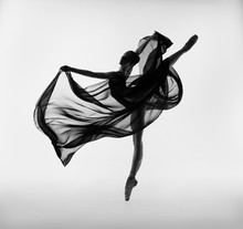 A Ballerina Dances With A Black Cloth