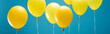 bright party yellow balloons on blue background, panoramic shot