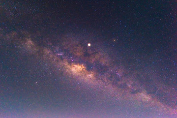 Wall Mural - night scenery with colorful and light yellow milky way full of stars in the sky in summer beautiful 