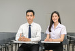 © kwanchaichaiudom - Asian student with braces on the teeth and friend in classroom