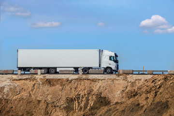 truck transports freight on the country highway