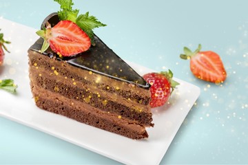 Canvas Print - Delicious chocolate cake on plate on background