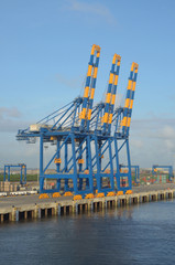 Wall Mural - Mooring container cargo crane awaiting cargo operations