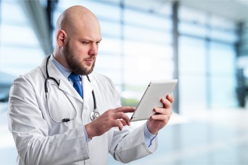 Poster - Close-up Doctor at hospital working with tablet pc