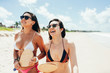 © kleberpicui - Two pretty girls having fun on tropical beach