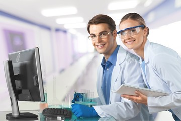 Wall Mural - Group of the scientists working at the laboratory