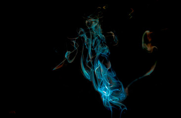 Colored smoke isolated on black background horse shaped