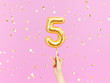 Five year birthday. Female hand holding Number 5 foil balloon.  Five-year anniversary background. 3d rendering