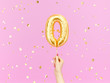 Zero on pink. Female hand holding Number 0 foil balloon. 3d rendering