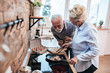 © bnenin - That smells delicious. Senior couple in the kitchen, cooking.