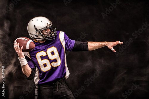 American Football Player Holding Ball In His Hands In Smoke Black Background Copy Space The Concept Of American Football Motivation Copy Space Buy This Stock Photo And Explore Similar Images At