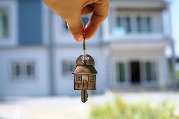 Wall Mural - Landlord unlocks the house key for new home