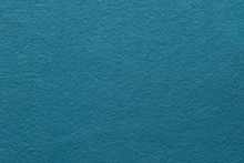 Teal Blue Felt Texture Abstract Art Background. Colored Fabric Fibers Surface. Empty Space.