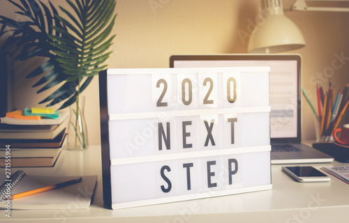 2020 Next Step Text On Light Box On Desk Table In Home Office
