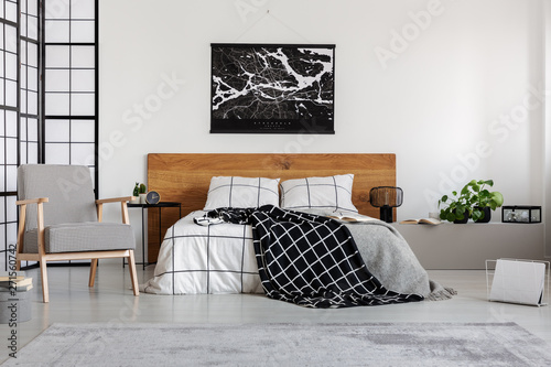 Black Map On White Wall Above Wooden Headboard In Simple
