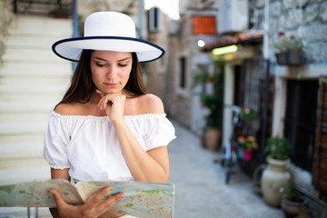 Happy young woman smiling and traveling at summer vacation