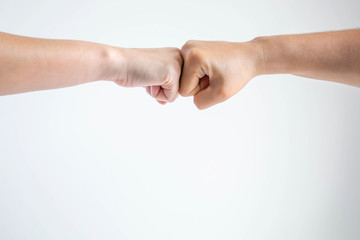 The fists bumping together on white background.