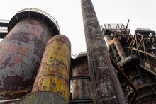 Composition Of Blast Furnaces And Smokestacks In An Old Steel Mill, Rust And Peeling Paint Patinas, Horizontal Aspect