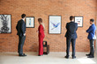© Pixel-Shot - People at exhibition in modern art gallery