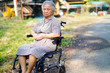 © amazing studio - Asian senior or elderly old lady woman patient on wheelchair in park : healthy strong medical concept