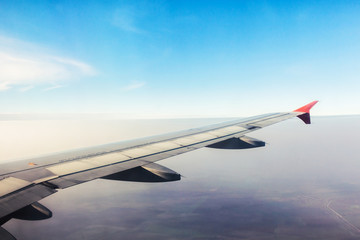 Wall Mural - plane wings and the sky view from the passenger window
