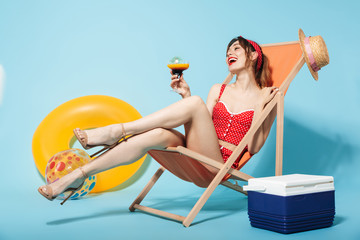 Wall Mural - Beautiful young woman wearing swimsuit relaxing