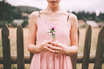 Cute caucasian girl posing for camera. Beautiful woman outdoor portrait.