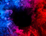 Fototapeta Tulipany - fusion of blue and red smoke in motion isolated on black background