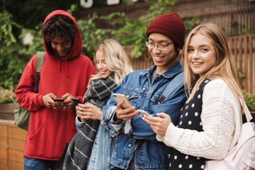 Poster - Group if cheerful multiethnic friends teenagers