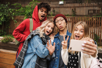group if cheerful multiethnic friends teenagers