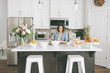 © Westend61 - Woman preparing a cake in her kitchen