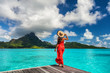 © Maridav - Bora Bora island luxury resort hotel woman relaxing at view of Mt Otemanu in Tahiti, French Polynesia Honeymoon travel destination for summer vacation.