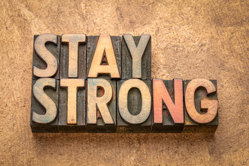 Wall Mural - stay strong word abstract in wood type